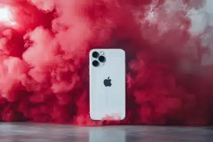 a white cell phone with red smoke